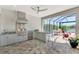 Well-equipped outdoor kitchen featuring modern appliances, countertop space, and easy access to the screened lanai at 5437 Manchini St, Sarasota, FL 34238