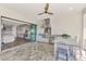 Outdoor kitchen featuring stainless steel appliances, granite counters, and bar seating at 5437 Manchini St, Sarasota, FL 34238