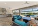 Stylish outdoor kitchen and lanai is perfect for entertaining, with seating, cooking area, and serene water views at 5437 Manchini St, Sarasota, FL 34238