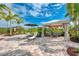 Lounge area with seating, a sun umbrella, and sun loungers at 5437 Manchini St, Sarasota, FL 34238