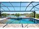 Relaxing pool view and the lovely pond view in the distance. A great way to unwind with a view of the Florida waterscape at 5437 Manchini St, Sarasota, FL 34238