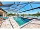 Beautiful pool features a screened lanai, serene lake views, and a seamless transition to outdoor living at 5437 Manchini St, Sarasota, FL 34238