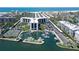 Beautiful aerial view of the building, waterfront, tennis court, and easy access to the beach at 5855 Midnight Pass Rd # 512, Sarasota, FL 34242