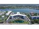 Stunning aerial view of condo community with bay access and waterfront views at 5855 Midnight Pass Rd # 512, Sarasota, FL 34242