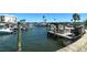 Community boat dock with multiple boats, giving residents a relaxing place to keep their boats at 5855 Midnight Pass Rd # 512, Sarasota, FL 34242