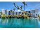 Relaxing waterfront condos showcasing a serene pond with water feature at 5855 Midnight Pass Rd # 512, Sarasota, FL 34242