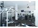 Bright fitness center featuring a variety of exercise equipment, mirrors, and a ceiling fan at 5855 Midnight Pass Rd # 512, Sarasota, FL 34242