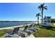Waterfront gazebo and lounge chairs in the community area, offering a lovely space for residents at 5855 Midnight Pass Rd # 512, Sarasota, FL 34242