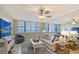 Comfortable living room with tile floors, neutral decor, and plenty of natural light at 5855 Midnight Pass Rd # 512, Sarasota, FL 34242