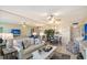 Open floor plan with living and dining areas featuring tile floors and neutral decor at 5855 Midnight Pass Rd # 512, Sarasota, FL 34242