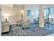 Comfortable seating area in a building lobby with modern decor and large windows at 5855 Midnight Pass Rd # 512, Sarasota, FL 34242