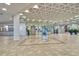 Spacious lobby featuring tiled floors, modern decor, mirrored walls, and elevators at 5855 Midnight Pass Rd # 512, Sarasota, FL 34242