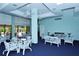 Community lounge area with comfortable seating and an outdoor patio at 5855 Midnight Pass Rd # 512, Sarasota, FL 34242