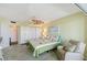 This bedroom has carpet, neutral paint, a fan, and balcony access for beautiful Florida living at 5855 Midnight Pass Rd # 512, Sarasota, FL 34242