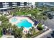 Tropical pool area with lush landscaping and comfortable lounge chairs at 5855 Midnight Pass Rd # 512, Sarasota, FL 34242