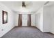 Carpeted bedroom featuring ample natural light and closet space at 6047 Arlene Way, Bradenton, FL 34207