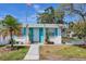 Home exterior with turquoise shutters and front walkway at 6047 Arlene Way, Bradenton, FL 34207