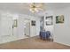 Inviting living room with neutral carpet, ceiling fan, and adjacent dining area at 6047 Arlene Way, Bradenton, FL 34207