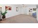 Spacious living room features neutral carpet, white walls, a ceiling fan, and natural light at 6047 Arlene Way, Bradenton, FL 34207
