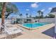 Community pool with lounge chairs and a covered area at 6047 Arlene Way, Bradenton, FL 34207