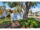 Community sign with landscaping and trees at 6047 Arlene Way, Bradenton, FL 34207