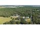Extensive treed property with multiple houses, barns, outbuildings and sheds at 6365 Jim Davis Rd, Parrish, FL 34219