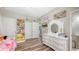 Bedroom with closet storage and adjacent view of the connected bath at 6365 Jim Davis Rd, Parrish, FL 34219