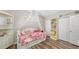 Bedroom featuring wood-look floors and closet storage space at 6365 Jim Davis Rd, Parrish, FL 34219