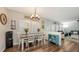 Bright dining room with hardwood floors and natural light, located between the kitchen and living spaces at 6365 Jim Davis Rd, Parrish, FL 34219