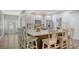 Open-concept kitchen featuring pendant lights, granite countertops and an island with barstool seating at 6365 Jim Davis Rd, Parrish, FL 34219