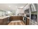 Well-equipped kitchen with stainless steel appliances, granite counters, and seamless flow to the living area at 6365 Jim Davis Rd, Parrish, FL 34219