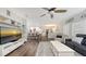 Bright, open-concept view from the living room into the breakfast area and kitchen; note the uniform flooring at 6365 Jim Davis Rd, Parrish, FL 34219