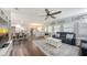 Bright, open-concept view from the living room into the breakfast area and kitchen; note the uniform flooring at 6365 Jim Davis Rd, Parrish, FL 34219