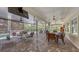 Inviting screened porch with brick flooring and ample seating, perfect for outdoor relaxation and entertaining at 6365 Jim Davis Rd, Parrish, FL 34219