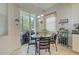 Cozy breakfast nook with table, chairs, pendant lighting, and sliding door to the patio at 6412 Golden Eye Gln, Lakewood Ranch, FL 34202
