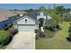 Charming one-story home featuring a manicured lawn, mature landscaping and a two-car garage at 6412 Golden Eye Gln, Lakewood Ranch, FL 34202