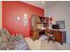 Spacious home office with custom built-ins and futon, ideal for work or relaxation at 6412 Golden Eye Gln, Lakewood Ranch, FL 34202