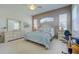 Spacious main bedroom with abundant natural light and a walk-in closet at 6412 Golden Eye Gln, Lakewood Ranch, FL 34202