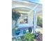 Inviting front porch adorned with potted plants, featuring pillars with the house number adding a personal touch at 6442 Barberry Ct, Lakewood Ranch, FL 34202