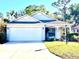 Charming single-story home with a well-maintained lawn, attached two-car garage and inviting curb appeal at 6442 Barberry Ct, Lakewood Ranch, FL 34202