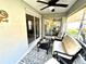 Cozy screened-in patio with a ceiling fan and comfortable furniture, perfect for outdoor relaxation at 6442 Barberry Ct, Lakewood Ranch, FL 34202