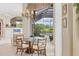 Charming breakfast nook with a view of the backyard and pool area, seating for four at 7011 Portmarnock Pl, Lakewood Ranch, FL 34202