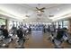 Community fitness center featuring a variety of cardio machines with natural light and ceiling fans at 7011 Portmarnock Pl, Lakewood Ranch, FL 34202