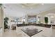 Open kitchen with an island, black granite countertops and eat-in area at 7011 Portmarnock Pl, Lakewood Ranch, FL 34202