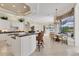 Spacious kitchen with island seating, granite countertops and a view of the outdoor pool at 7011 Portmarnock Pl, Lakewood Ranch, FL 34202