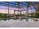 Enclosed swimming pool with spa and outdoor decor at 7011 Portmarnock Pl, Lakewood Ranch, FL 34202
