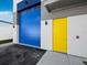Business with blue doors and yellow doors, offering an industrial-chic aesthetic at 8100 Ciboney Ct # 11, Sarasota, FL 34240