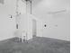 Utility area featuring a sink, door, and mini split in this commercial building at 8100 Ciboney Ct # 11, Sarasota, FL 34240