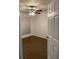 Bedroom with neutral walls, a ceiling fan, and new flooring, and natural light at 8617 Fancy Finch Dr # 102, Tampa, FL 33614