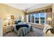 Inviting bedroom with neutral decor, large window overlooking the golf course, and plush carpeting at 8715 52Nd E Ave, Bradenton, FL 34211